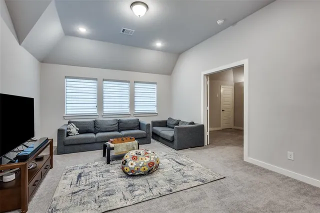 a living room with furniture and a rug