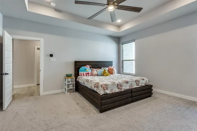 a bed room with a bed and a chair