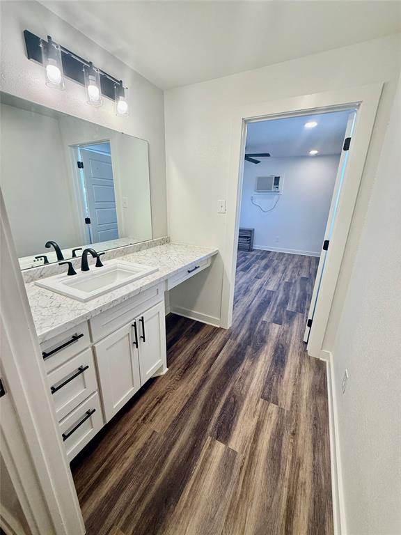 1541 McCarty Aspermont, TX 79502 - Photo 21 of 29 a bathroom with a sink mirror and vanity