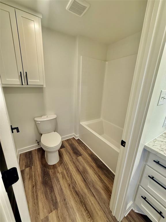 1541 McCarty Aspermont, TX 79502 - Photo 22 of 29 a bathroom with a toilet and a shower