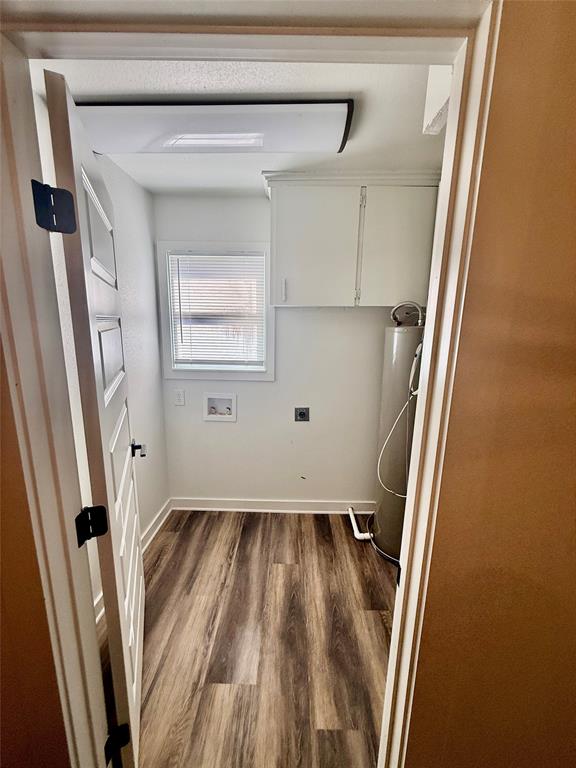 1541 McCarty Aspermont, TX 79502 - Photo 24 of 29 a view of an empty room with wooden floor and a window