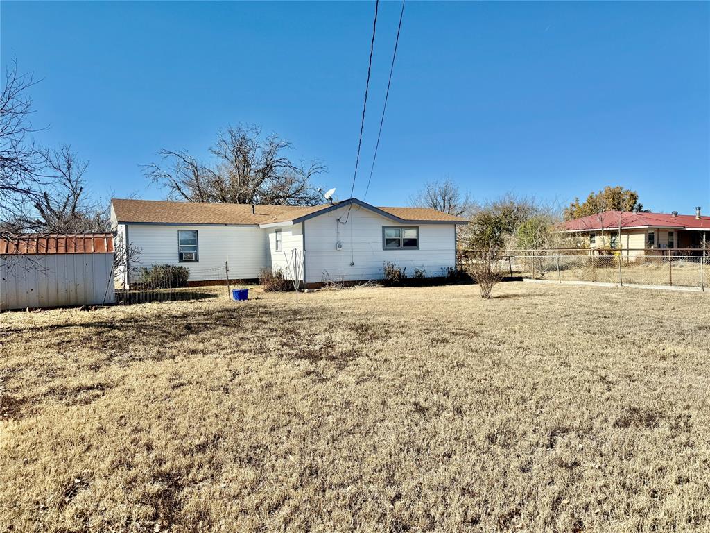 1541 McCarty Aspermont, TX 79502 - Photo 25 of 29 a view of a house with a yard