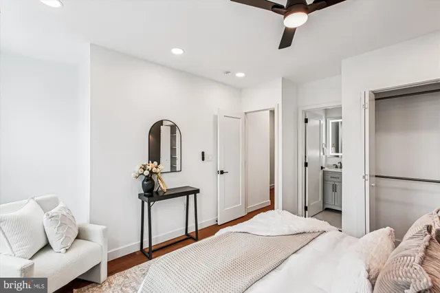 a bedroom with a bed and a couch