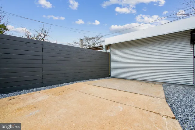 a view of a brick house with large windows
