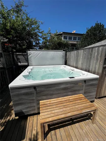 a view of sitting space and deck in the backyard