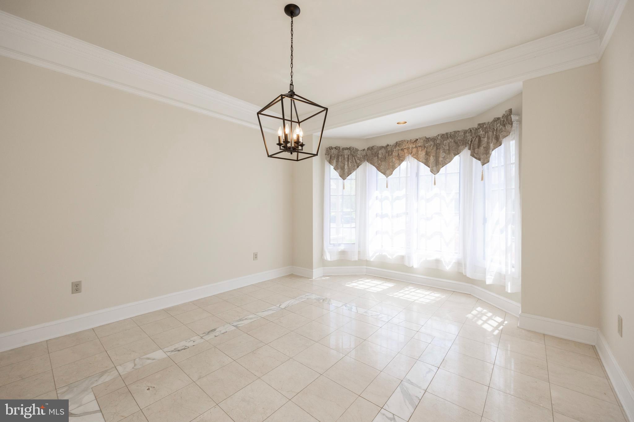 224 Cambridge Chase Exton, PA 19341 - Photo 14 of 40 Dining room with marble floors and cool fixture