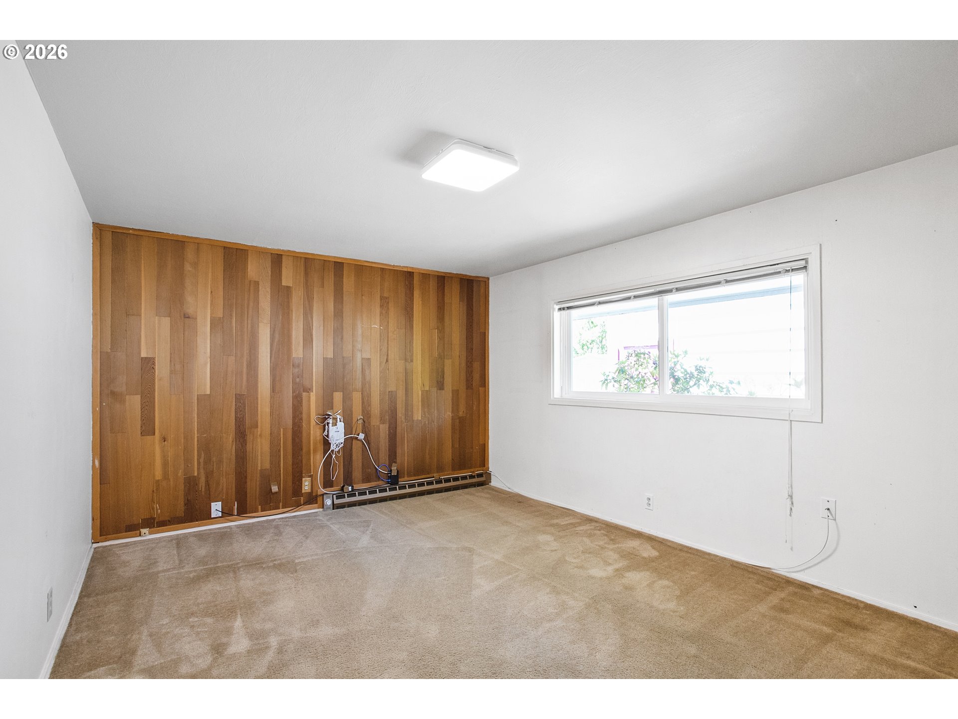 2840 Ferry Street Eugene, OR 97405 - Photo 16 of 35 a view of an empty room with a window