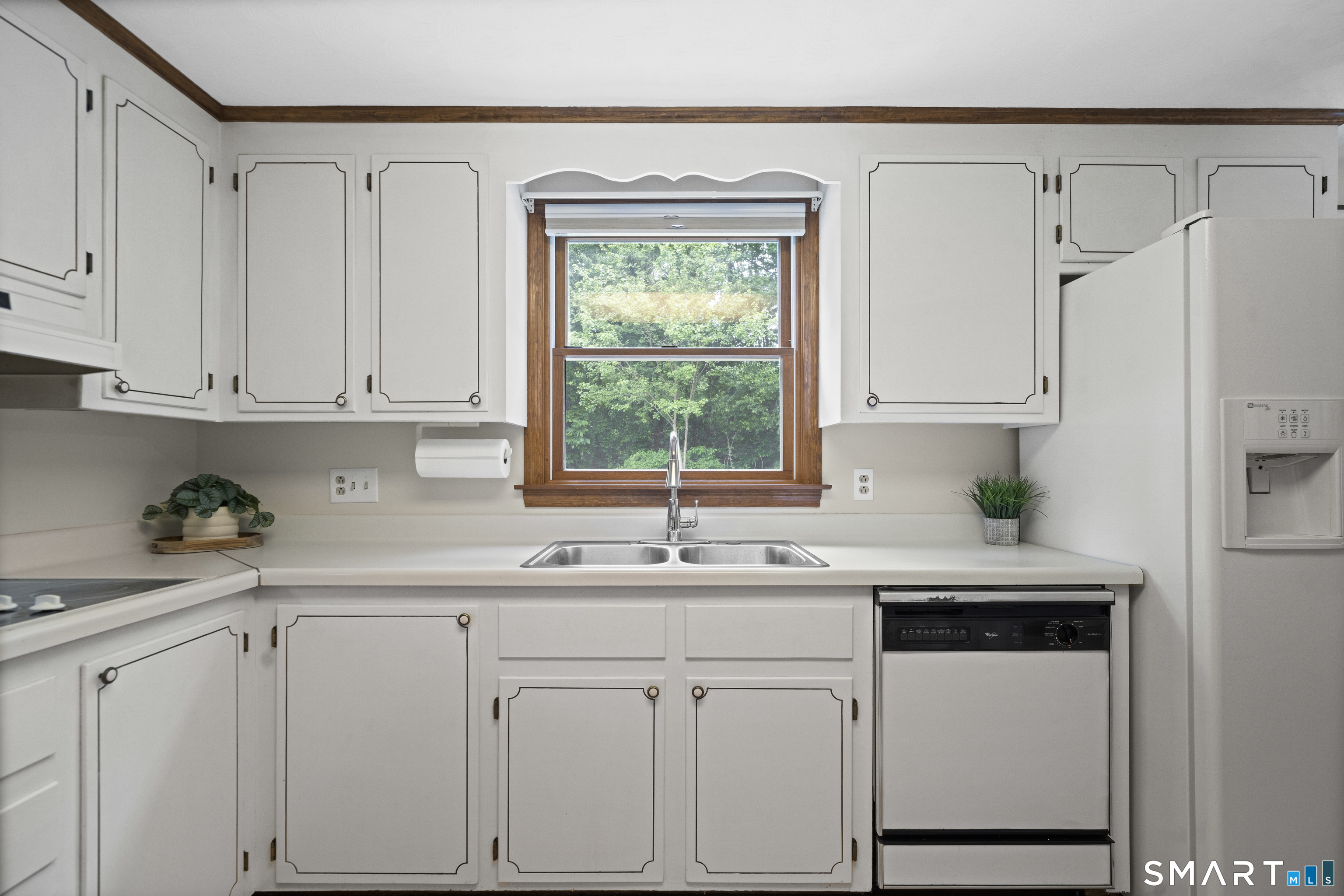 6 Cartier Road Enfield, CT 06082 - Photo 11 of 40 a kitchen with white cabinets and white appliances