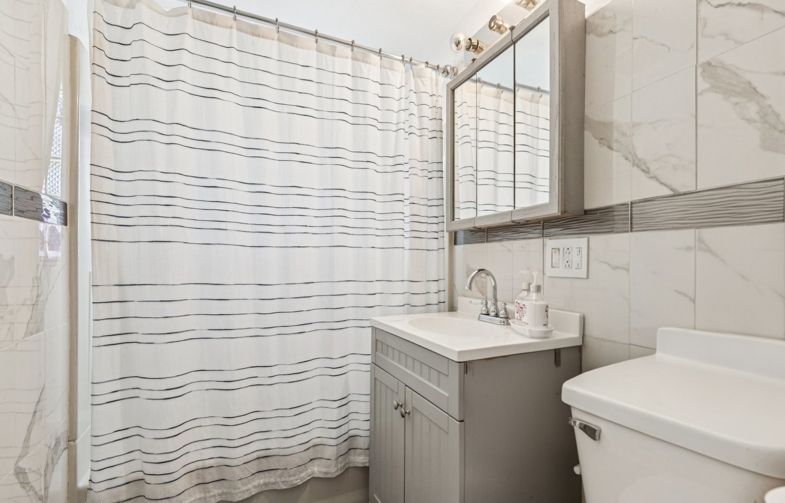 122 West Helen Road Palatine, IL 60067 - Photo 16 of 58 a bathroom with a sink and a toilet