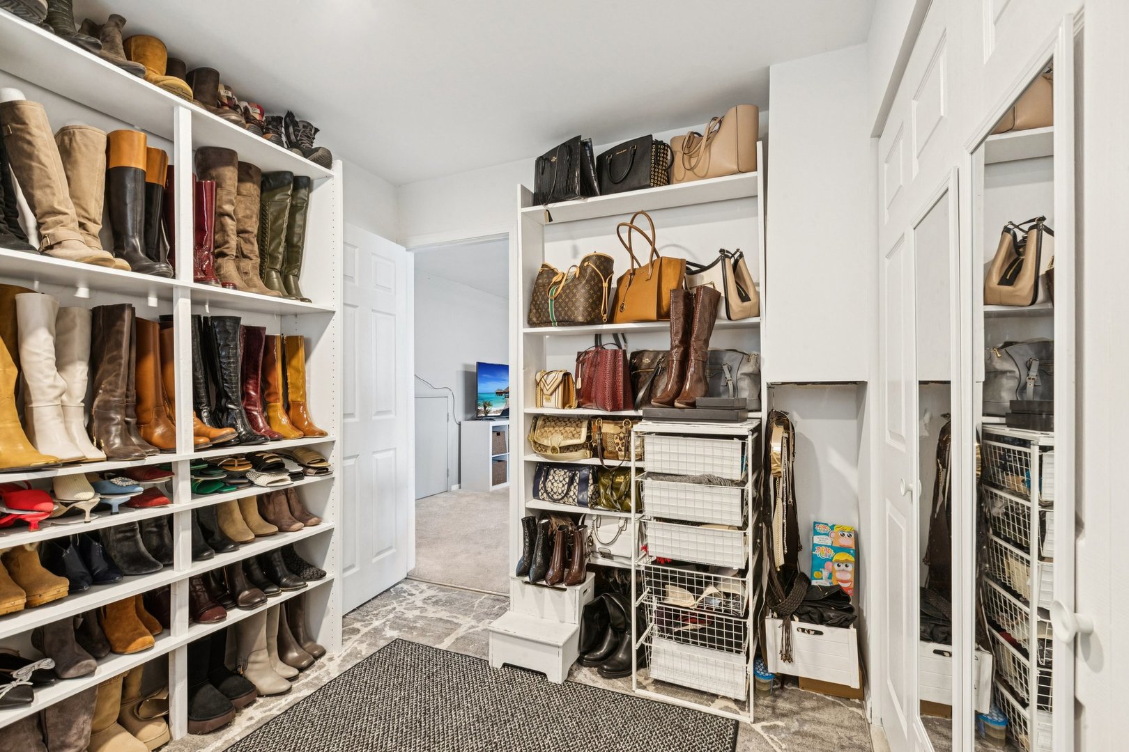 122 West Helen Road Palatine, IL 60067 - Photo 28 of 58 a view of walk in closet with clothes and shoes