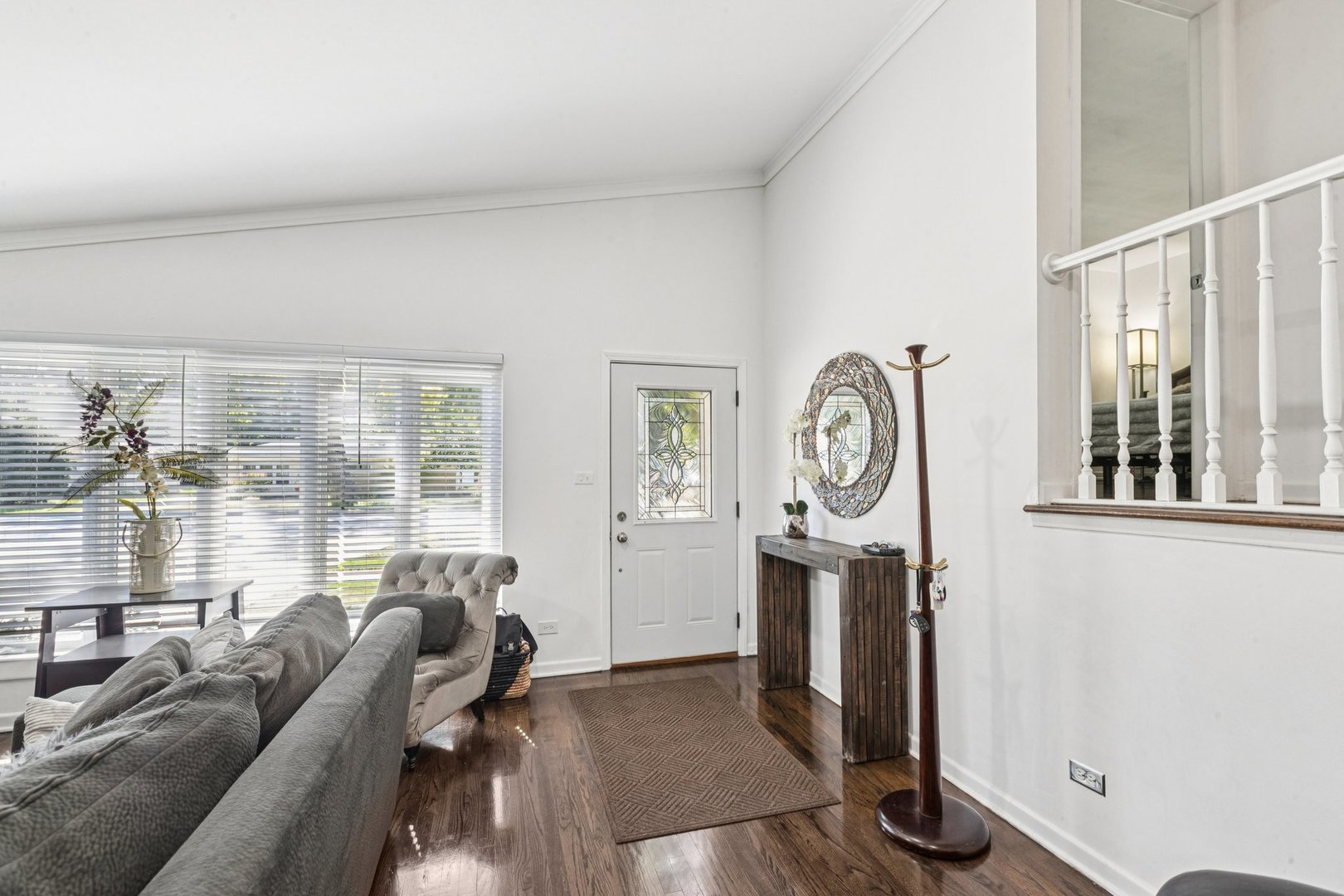 122 West Helen Road Palatine, IL 60067 - Photo 5 of 58 a living room with furniture a window and a clock