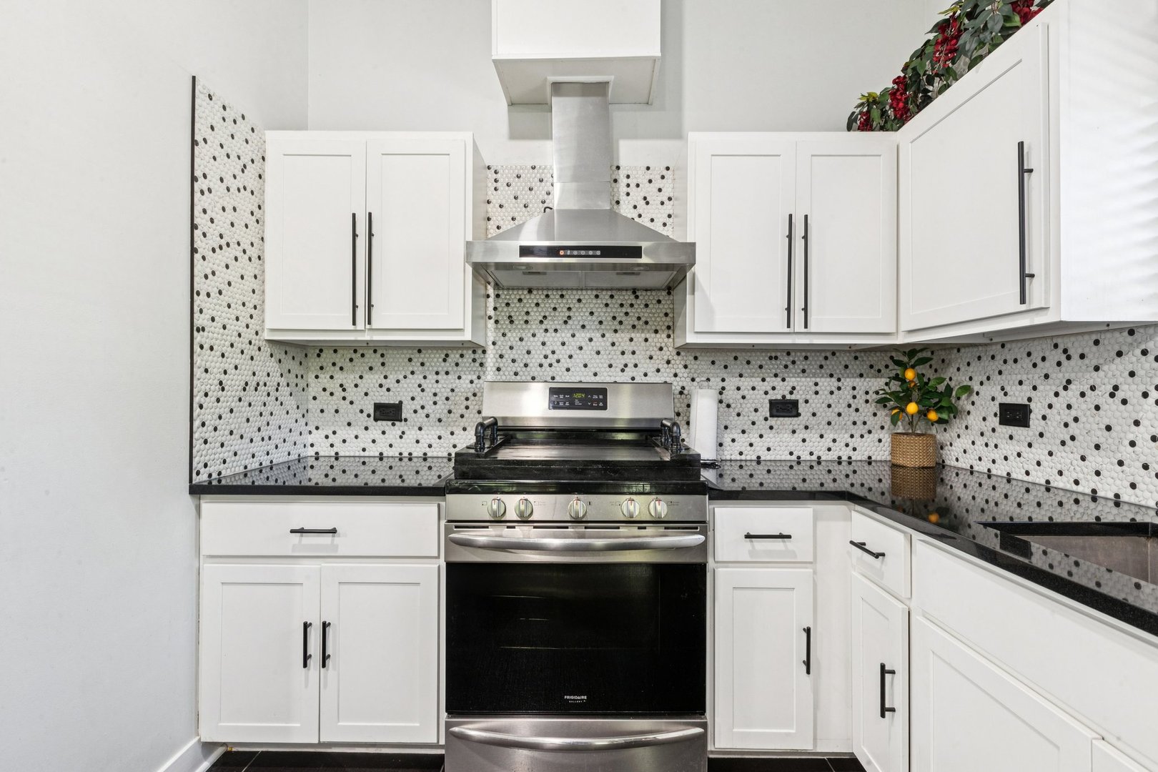 122 West Helen Road Palatine, IL 60067 - Photo 8 of 58 a kitchen with granite countertop a stove sink and cabinets