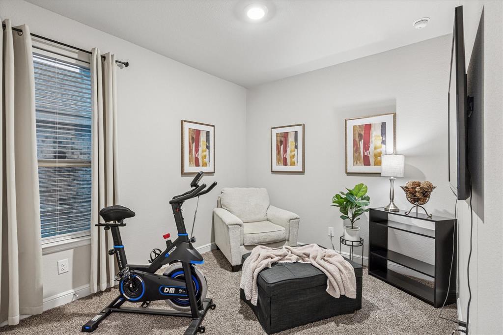 155 Texasage Street Rhome, TX 76078 - Photo 21 of 31 Bedroom No. 2 being used as a workout room