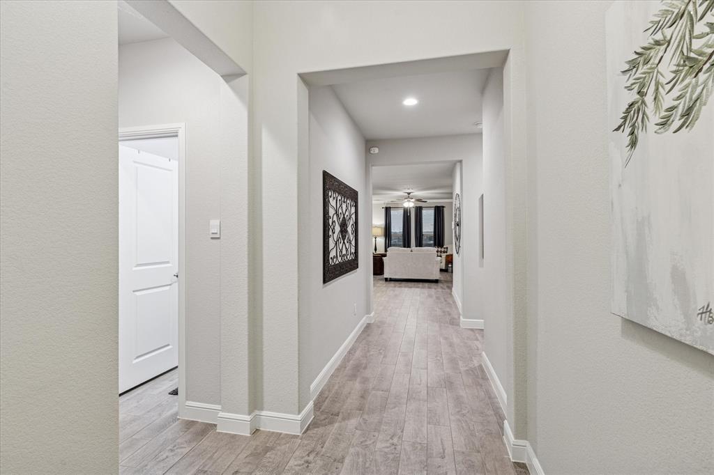 155 Texasage Street Rhome, TX 76078 - Photo 6 of 31 Hallway with wood finished floors, and recessed lighting