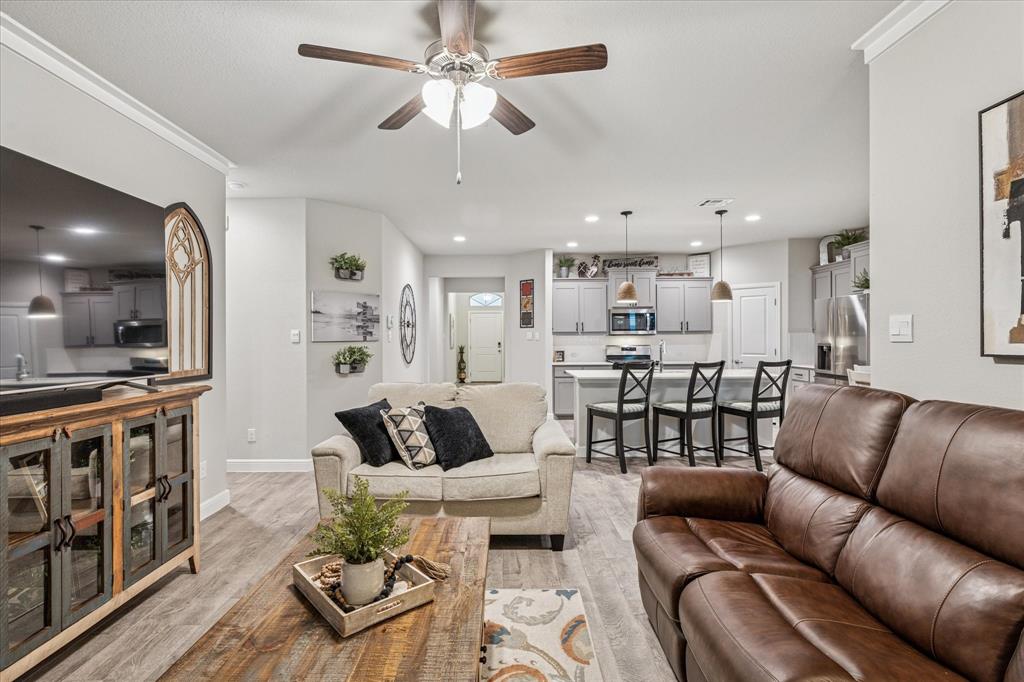 155 Texasage Street Rhome, TX 76078 - Photo 7 of 31 Living room with a ceiling fan, light wood finished floors, and recessed lighting
