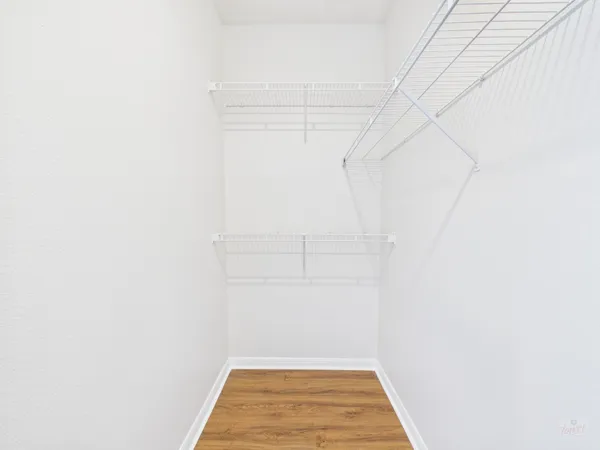 a view of a room with racks on the wall