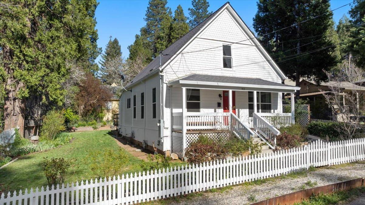411 Pine Street Grass Valley, CA 95945 - Photo 1 of 1 a front view of a house with a fence