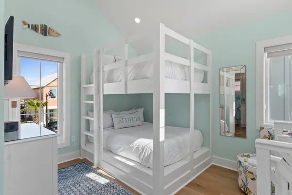a bedroom with a bed and a mirror