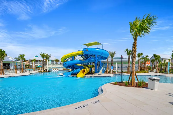 a view of a swimming pool with a table and chairs