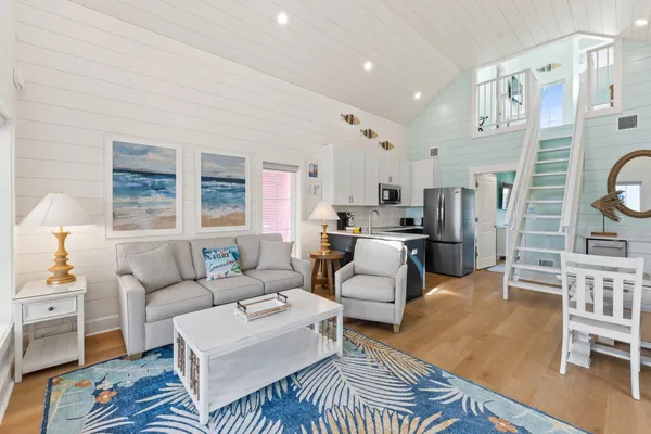a living room with furniture and a table