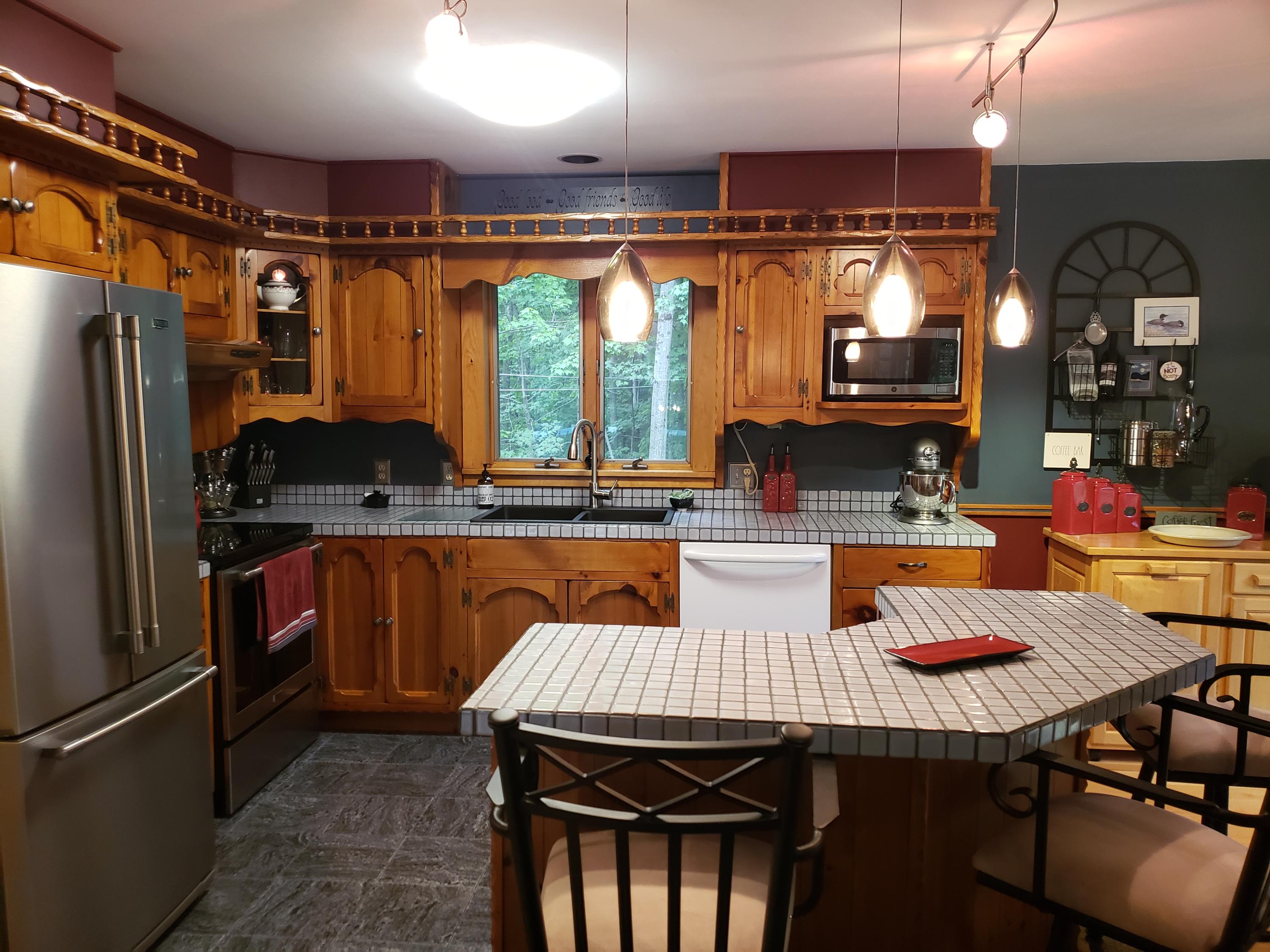 141 Warren Hill Road Jay, ME 04239 - Photo 22 of 101 Kitchen w/ tiled breakfast bar!