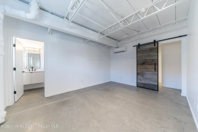 an empty room with a bathroom