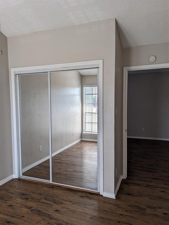 6108 Abrams Road, Unit 325 Dallas, TX 75231 - Photo 9 of 13 a view of empty room with wooden floor