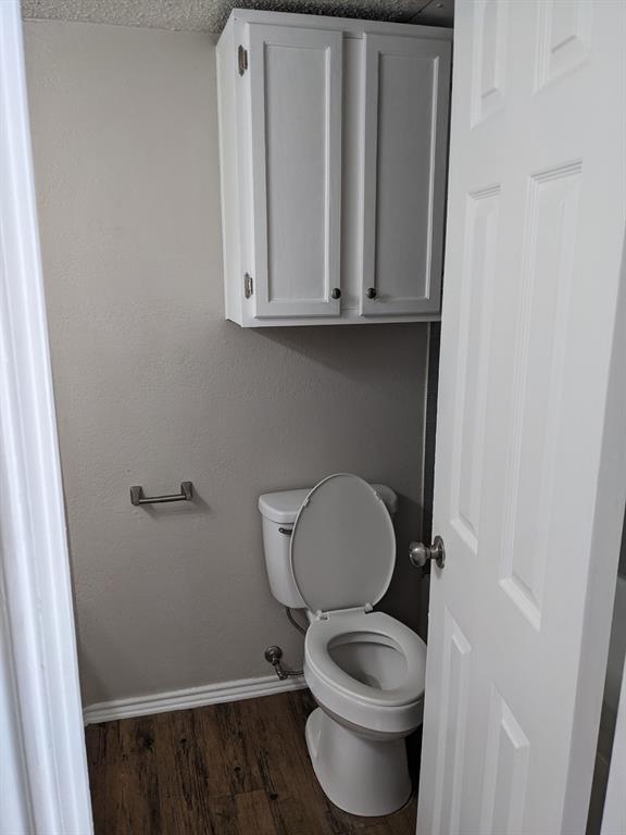 6108 Abrams Road, Unit 325 Dallas, TX 75231 - Photo 10 of 13 a bathroom with a toilet