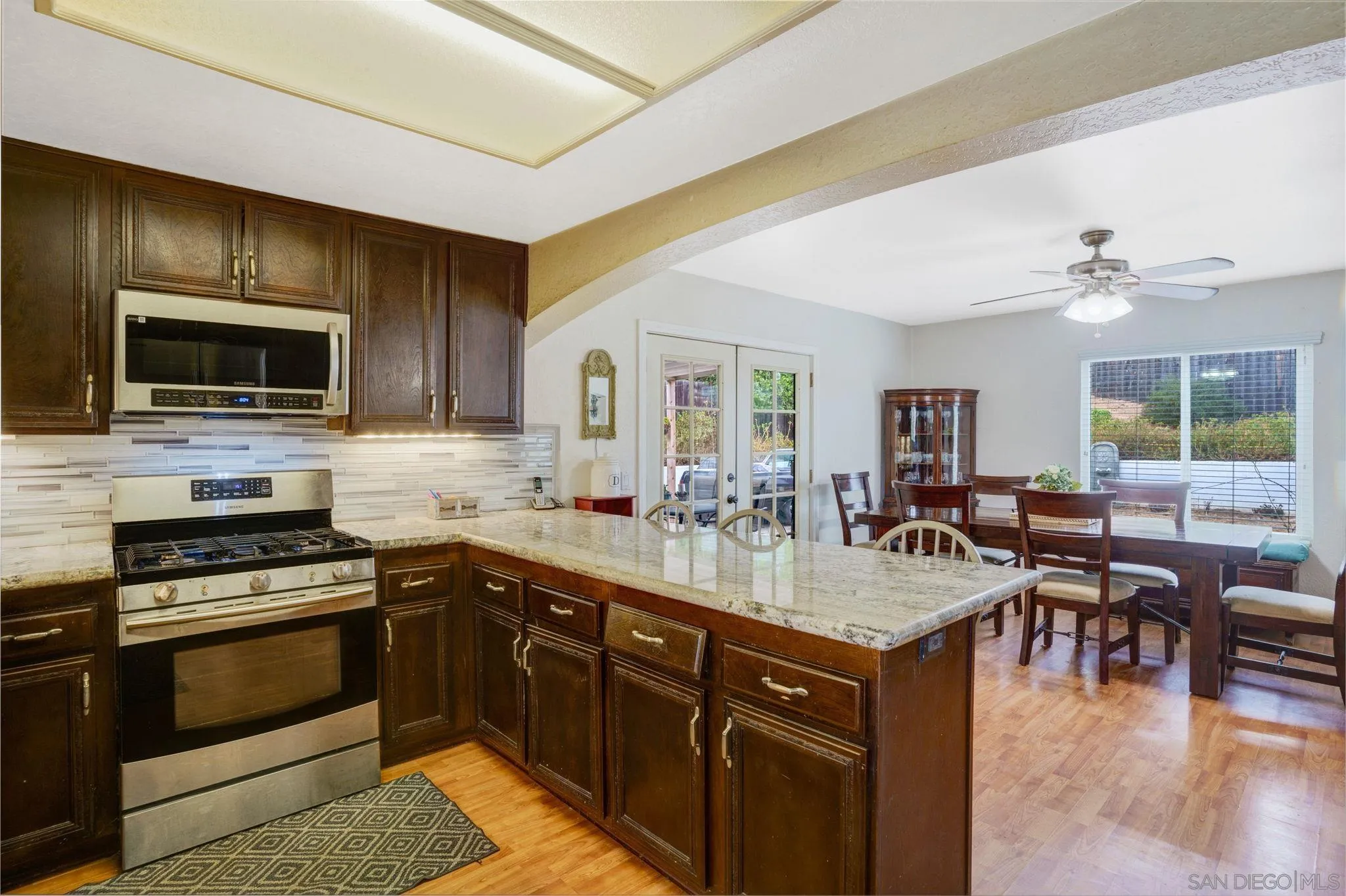 1082 Fulton Road San Marcos, CA 92069 - Photo 13 of 38 a kitchen with a sink stove and microwave