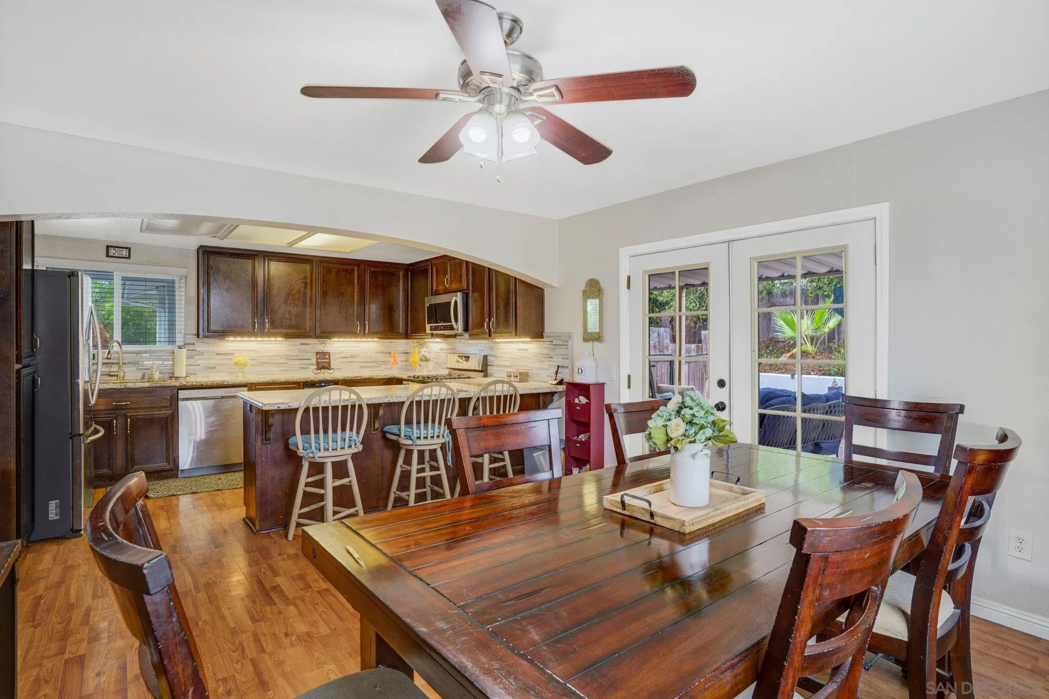 1082 Fulton Road San Marcos, CA 92069 - Photo 15 of 38 a view of a dining room with furniture window and wooden floor