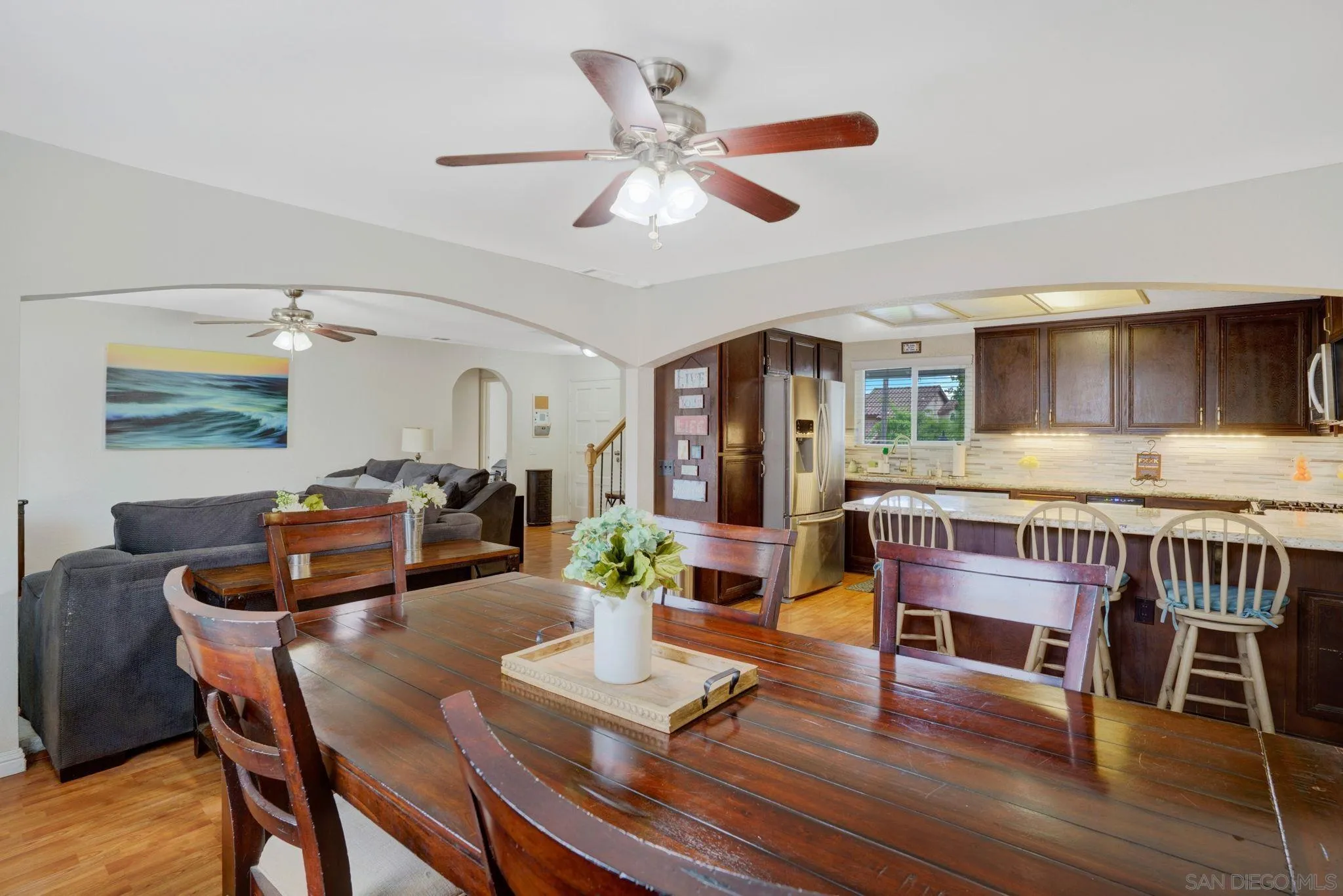 1082 Fulton Road San Marcos, CA 92069 - Photo 17 of 38 a dining room with furniture a window and wooden floor