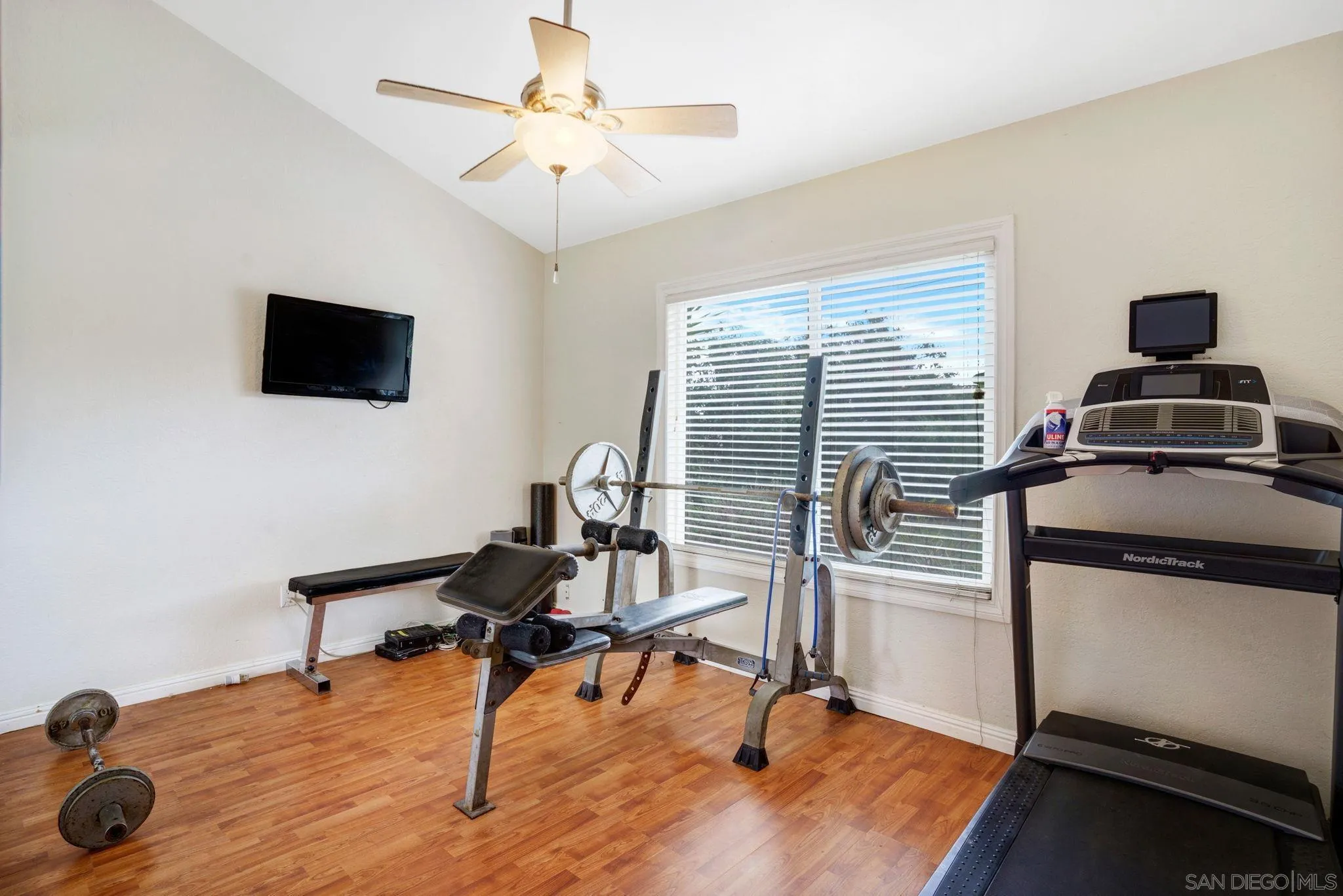 1082 Fulton Road San Marcos, CA 92069 - Photo 19 of 38 a view of a workspace with furniture and a window