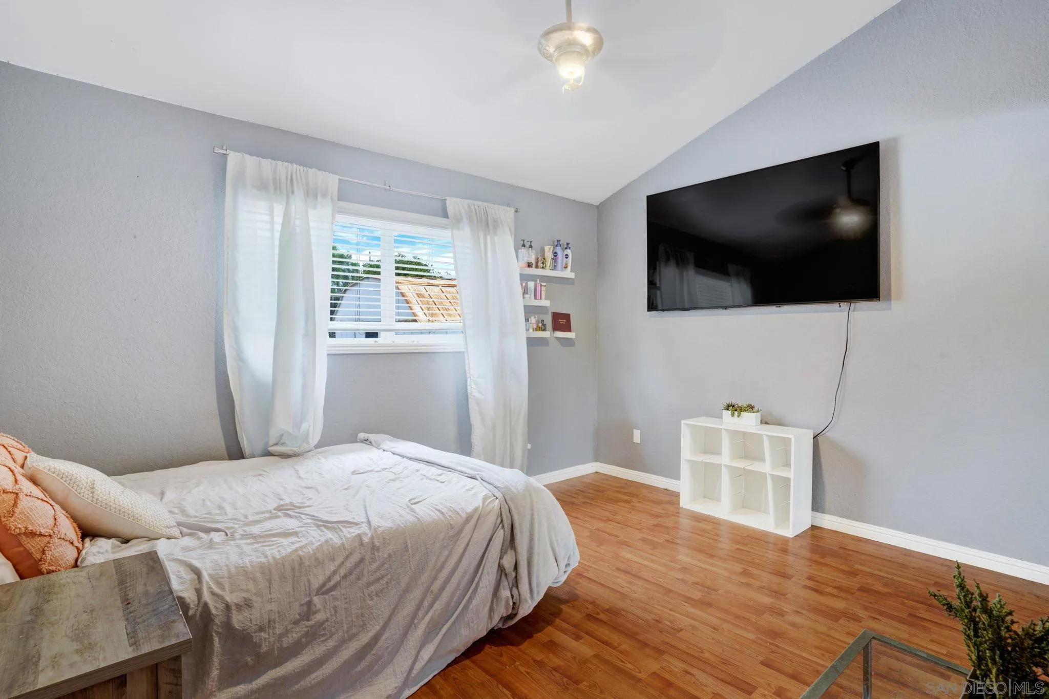 1082 Fulton Road San Marcos, CA 92069 - Photo 22 of 38 a bedroom with a bed and a flat screen tv