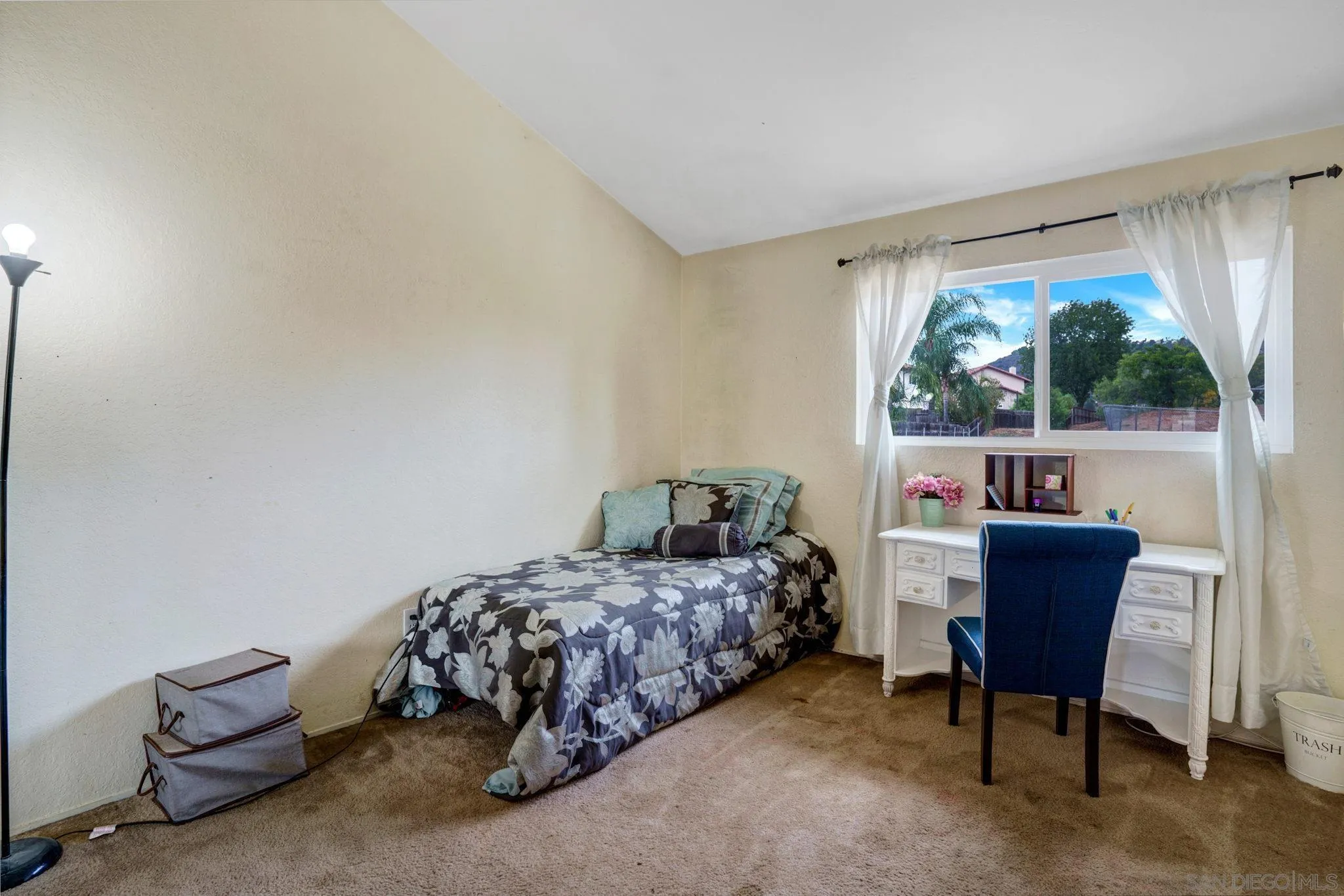 1082 Fulton Road San Marcos, CA 92069 - Photo 23 of 38 a bedroom with a bed and a table