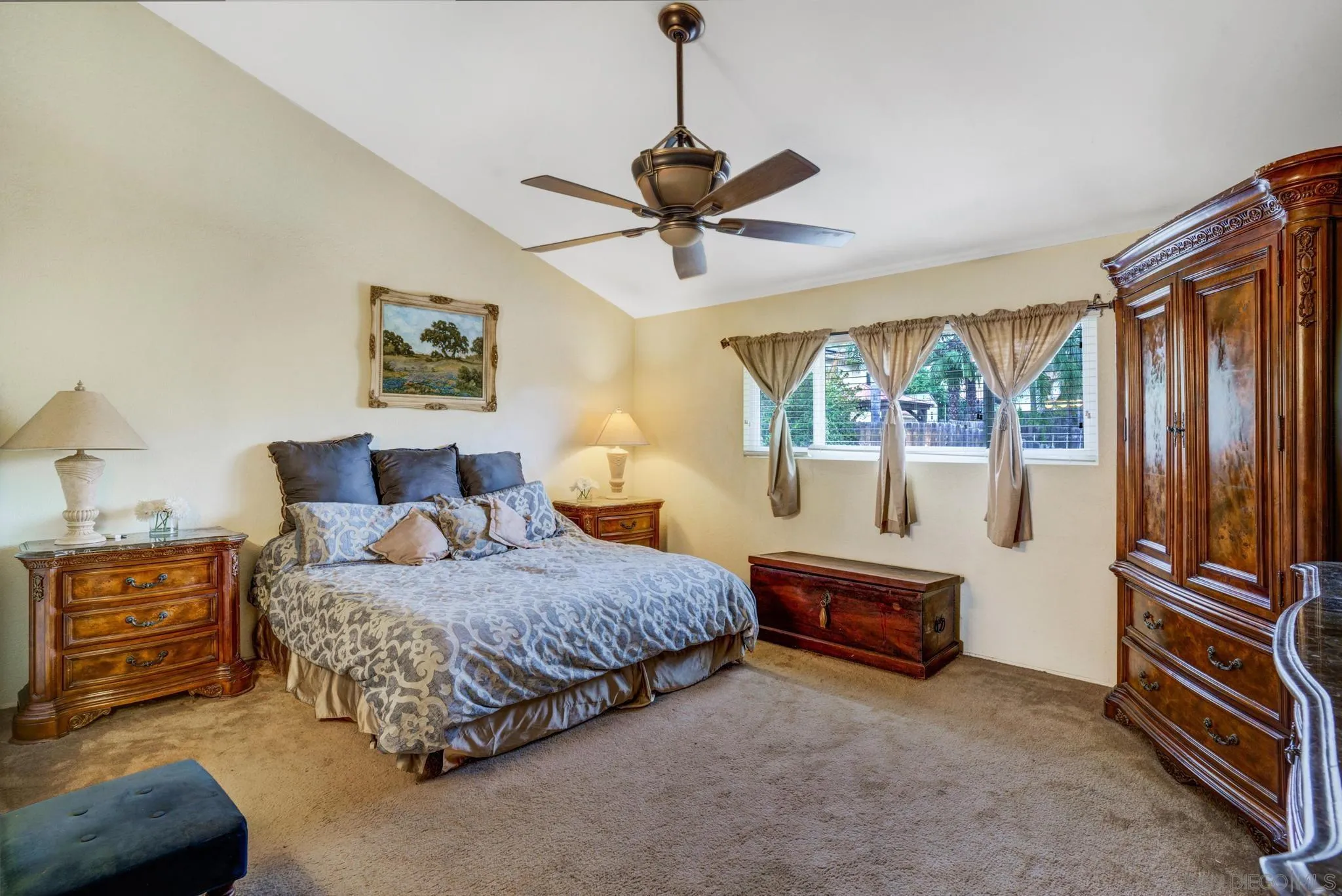1082 Fulton Road San Marcos, CA 92069 - Photo 24 of 38 a bedroom with a bed and a chandelier