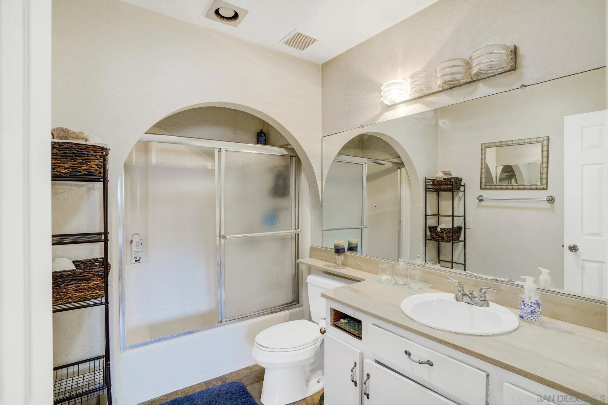 1082 Fulton Road San Marcos, CA 92069 - Photo 26 of 38 a bathroom with a granite countertop sink toilet and shower
