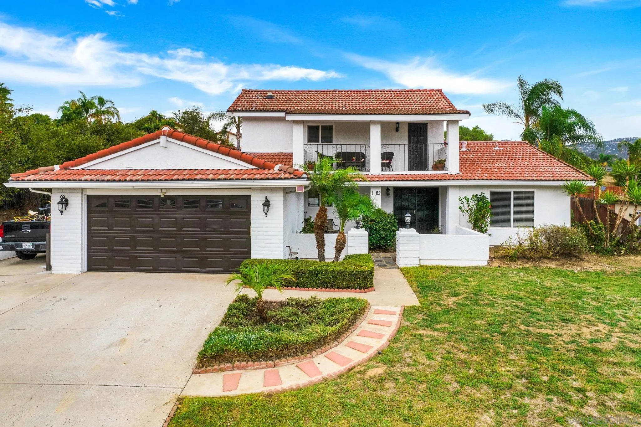 1082 Fulton Road San Marcos, CA 92069 - Photo 3 of 38 a front view of a house with a yard and porch