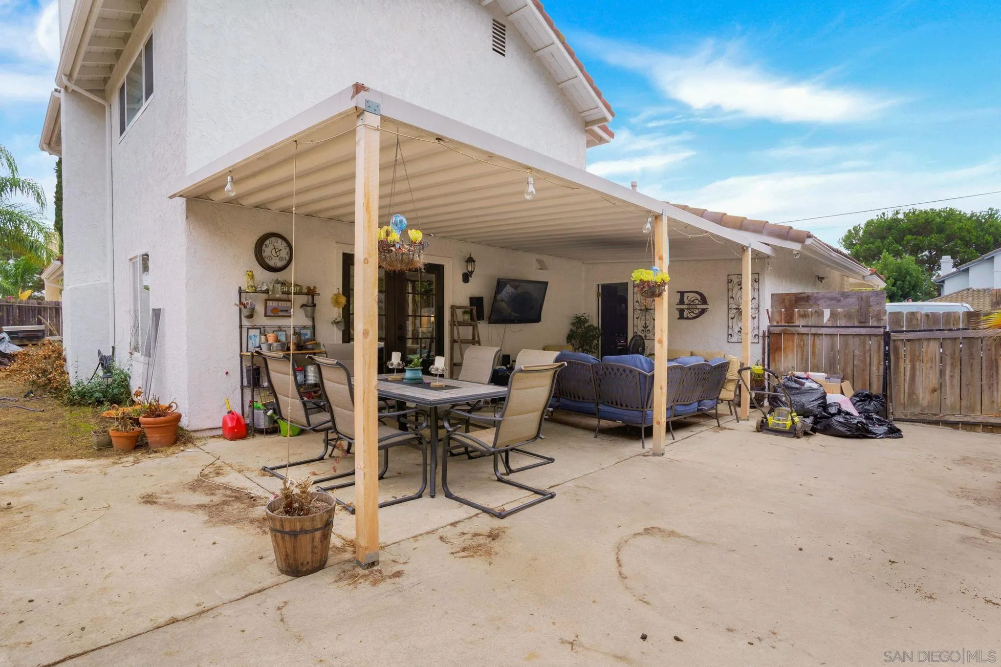 1082 Fulton Road San Marcos, CA 92069 - Photo 34 of 38 a view of a patio with table and chairs and potted plants