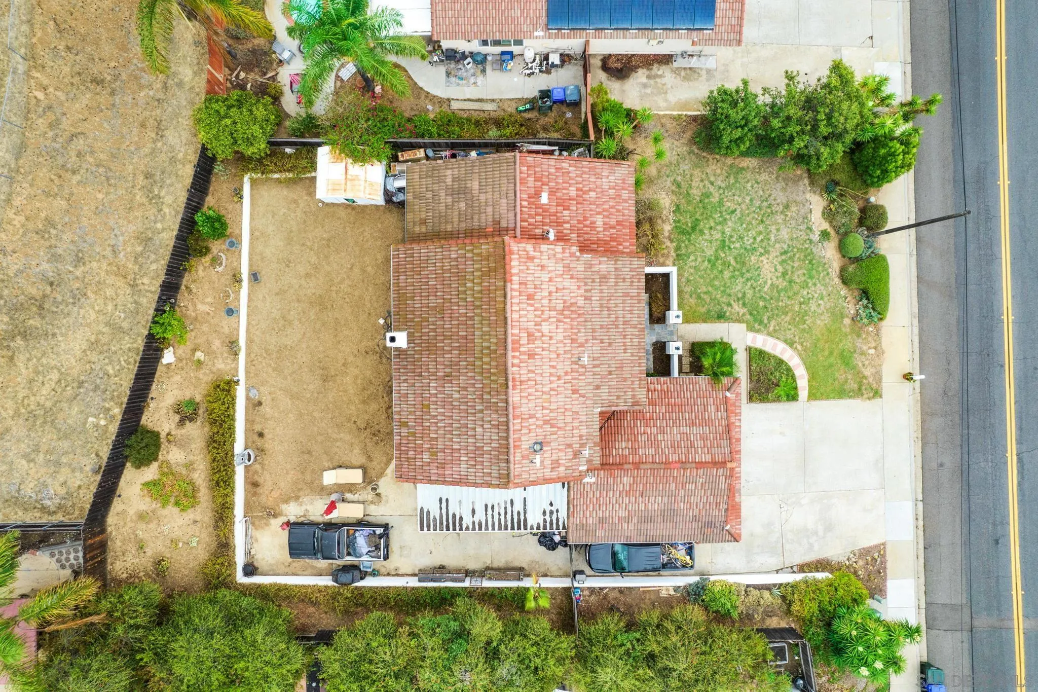 1082 Fulton Road San Marcos, CA 92069 - Photo 5 of 38 aerial view of a house with a yard and potted plants