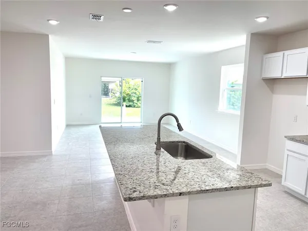 a kitchen with granite countertop a sink and a granite counter tops