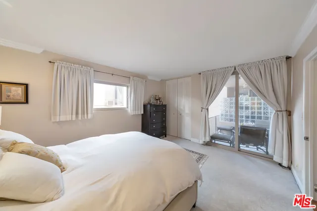 a bedroom with a bed and a fireplace