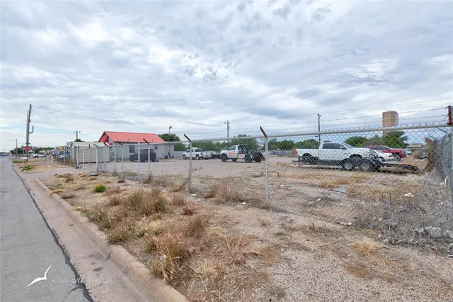 a view of car parked on road with building