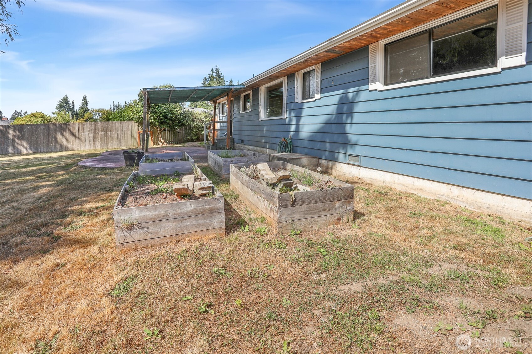 5626 Beverly Lane Everett, WA 98203 - Photo 31 of 38 a backyard of a house with yard and outdoor seating