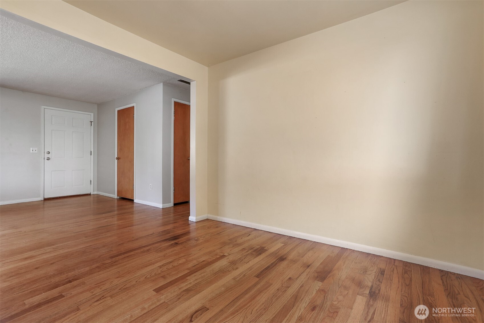 5626 Beverly Lane Everett, WA 98203 - Photo 10 of 38 a view of an empty room with wooden floor and closet