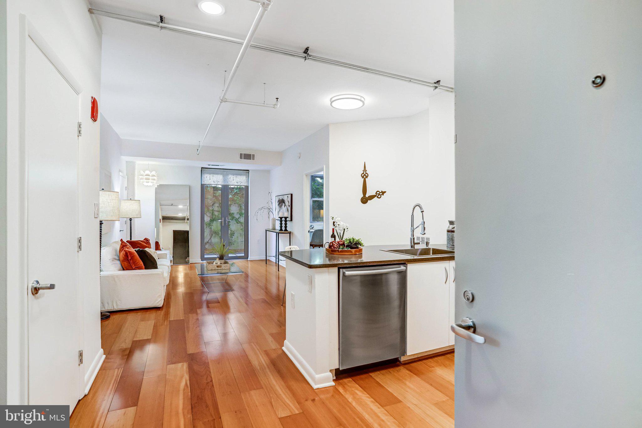 1300 N Street Northwest, Unit 15 Washington, DC 20005 - Photo 16 of 51 a view of a living room and dining room