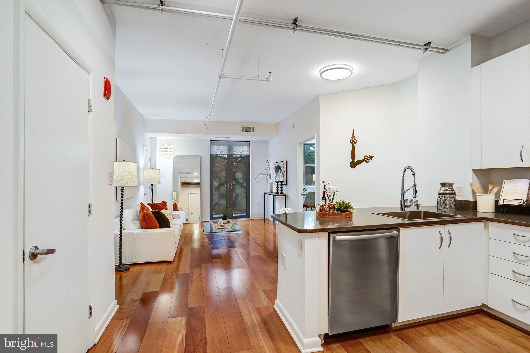 1300 N Street Northwest, Unit 15 Washington, DC 20005 - Photo 18 of 51 a view of a kitchen with sink and wooden floor
