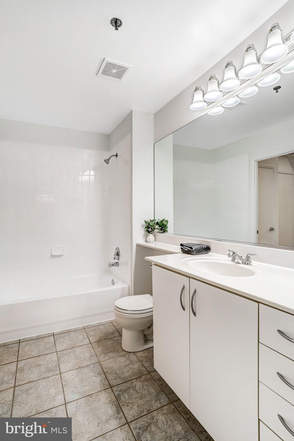 1300 N Street Northwest, Unit 15 Washington, DC 20005 - Photo 20 of 51 a bathroom with a sink a toilet and mirror