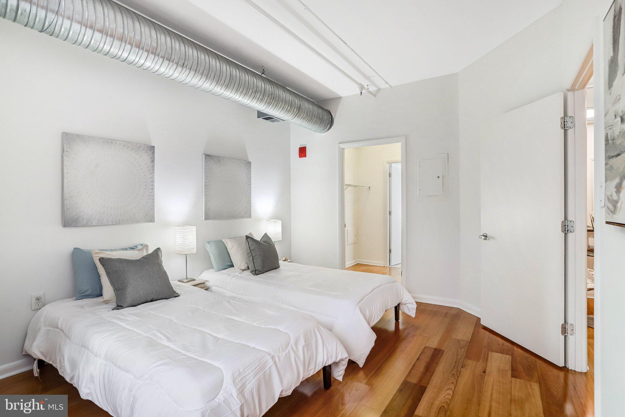 1300 N Street Northwest, Unit 15 Washington, DC 20005 - Photo 22 of 51 a bedroom with a bed and a mirror