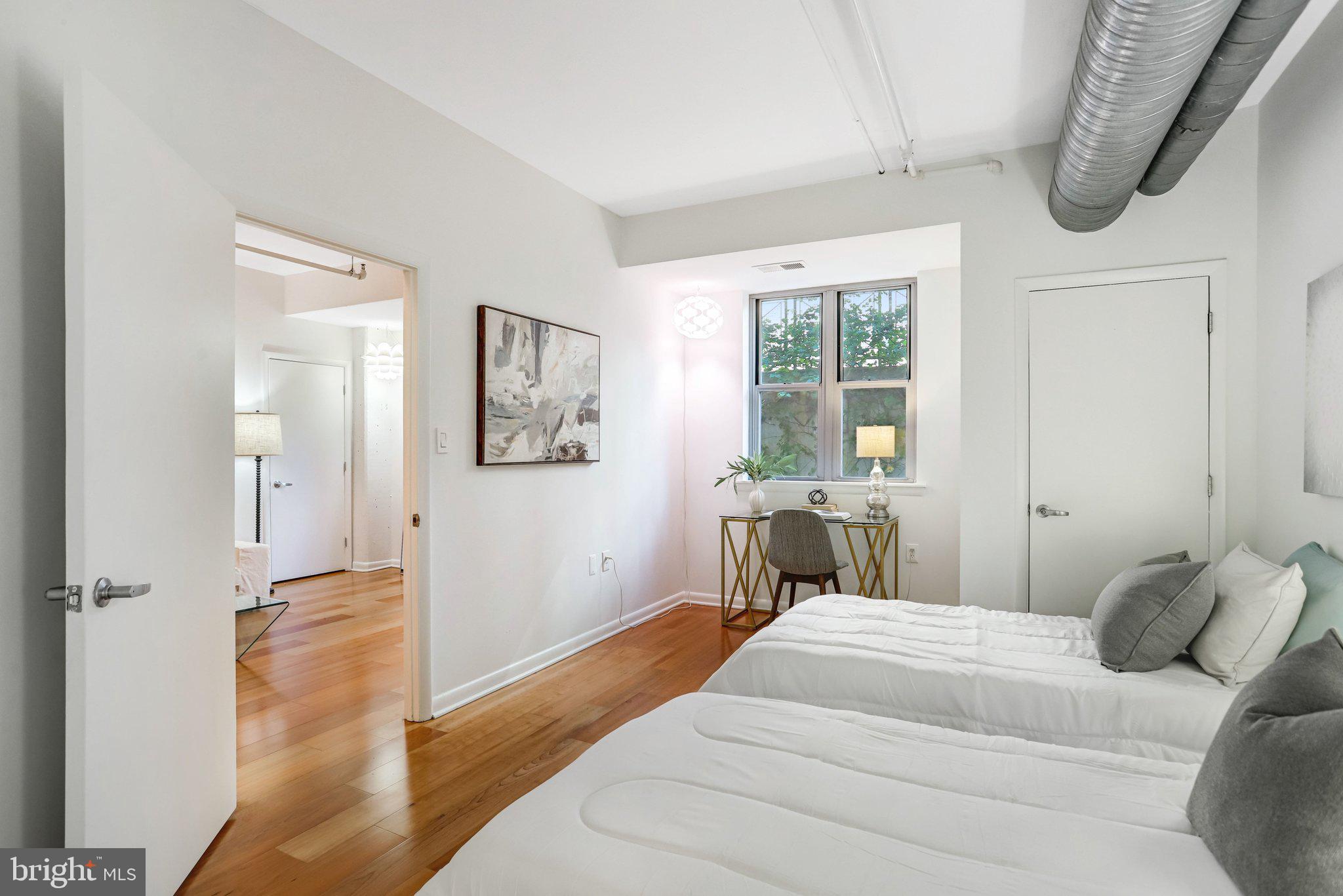 1300 N Street Northwest, Unit 15 Washington, DC 20005 - Photo 23 of 51 a bedroom with a bed and a window