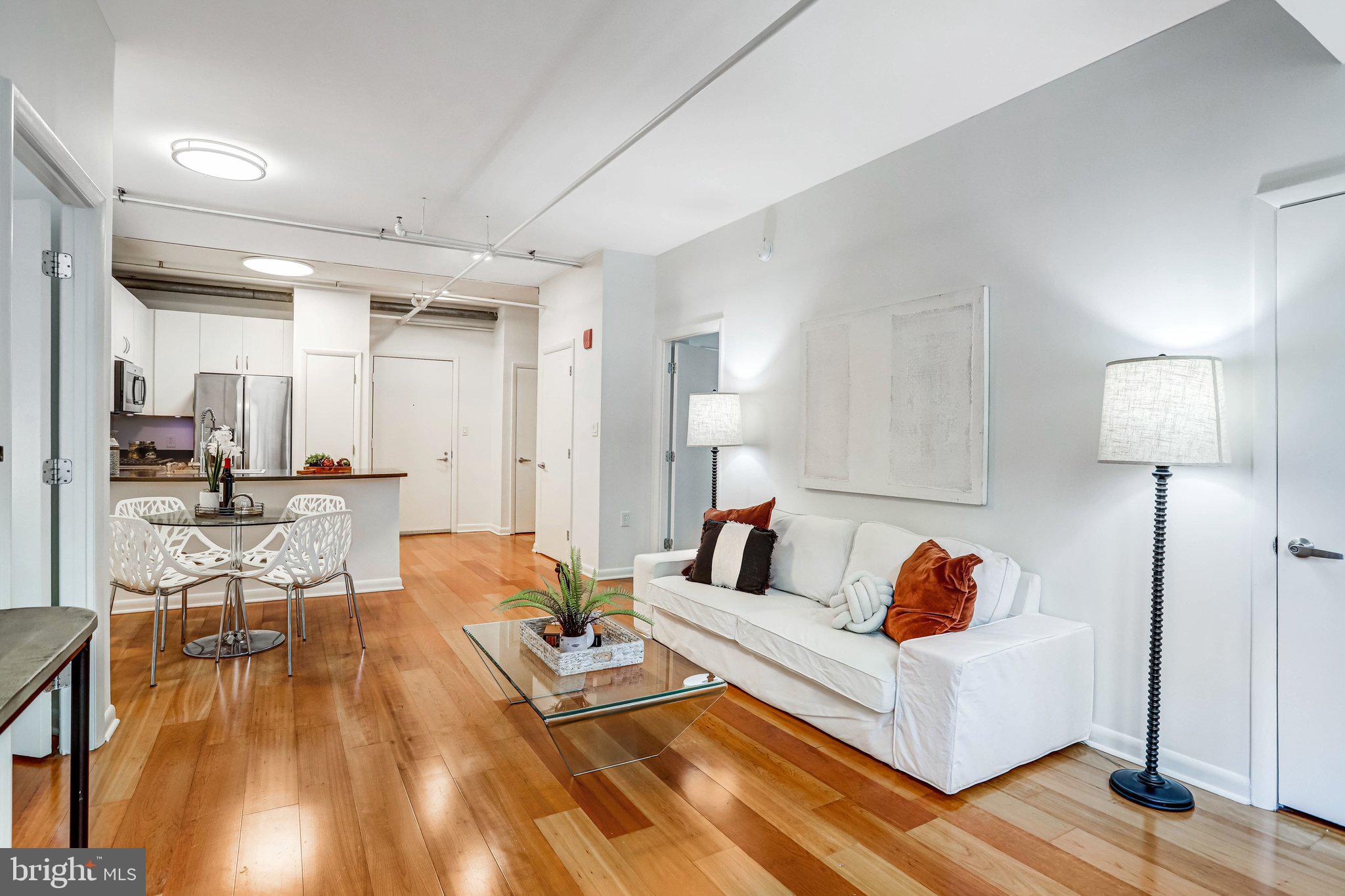 1300 N Street Northwest, Unit 15 Washington, DC 20005 - Photo 27 of 51 a living room with furniture and a table